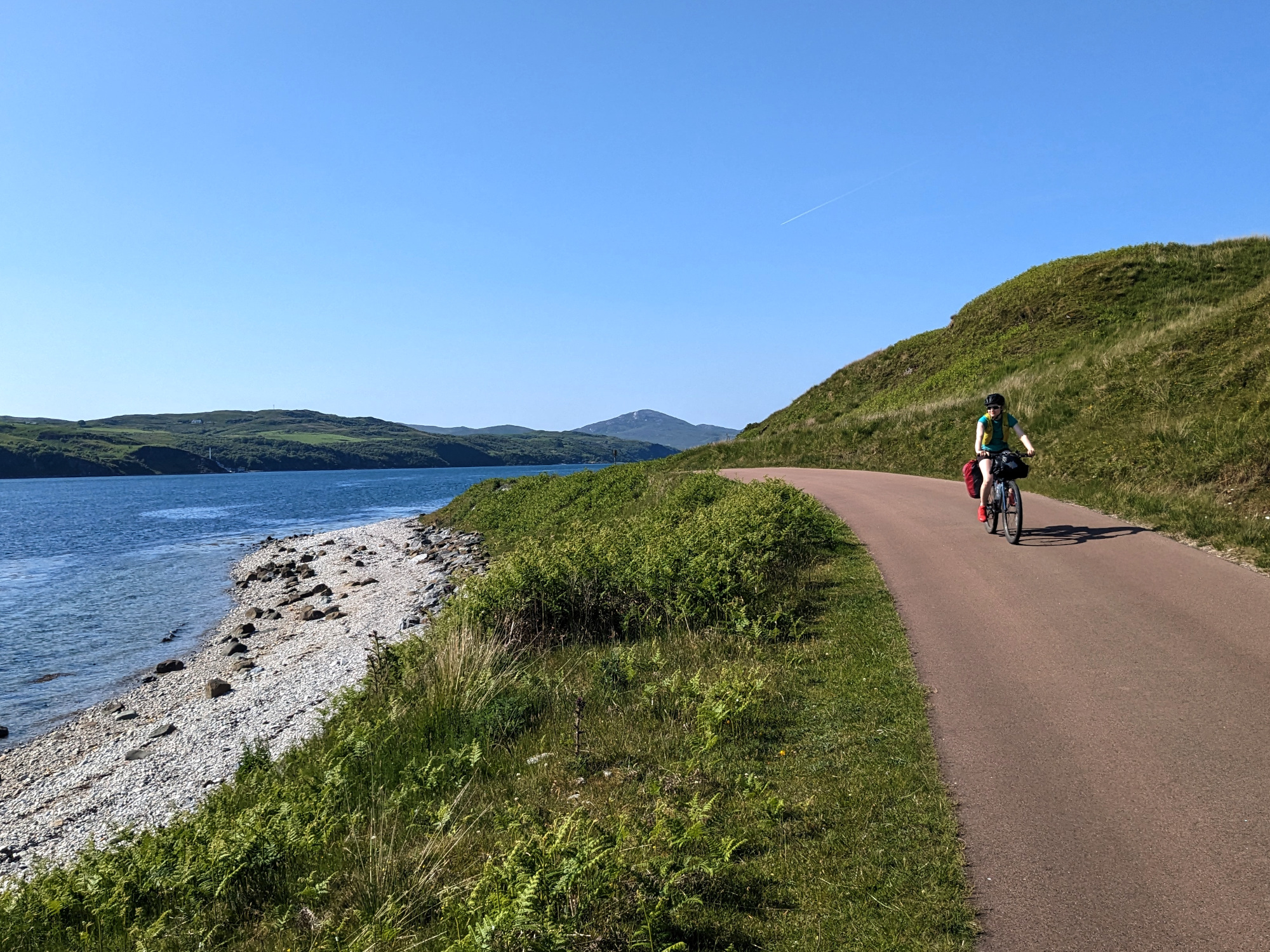 Faye cycling along the coastal path from the Feolin ferry.